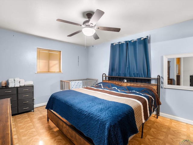 bedroom featuring ceiling fan and light parquet flooring