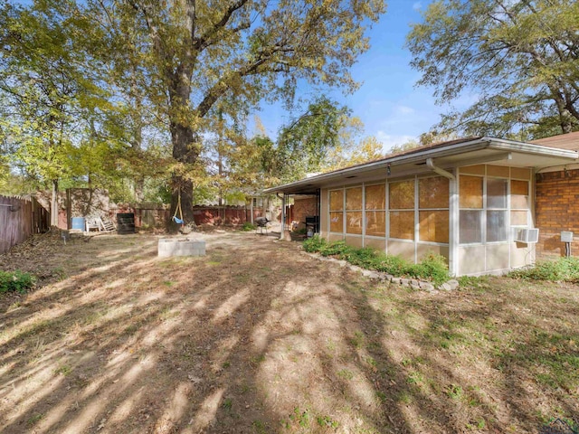 view of yard with a sunroom