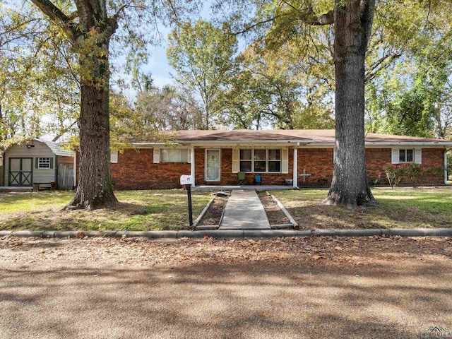 single story home with a shed