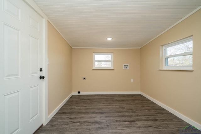 laundry area with dark wood-type flooring, ornamental molding, hookup for an electric dryer, and hookup for a washing machine