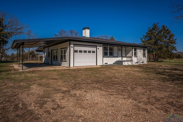 view of front of house with a garage and a front lawn