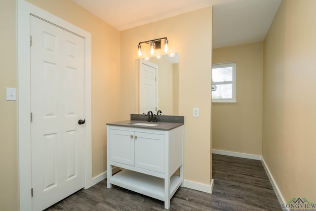 bathroom featuring vanity and wood-type flooring