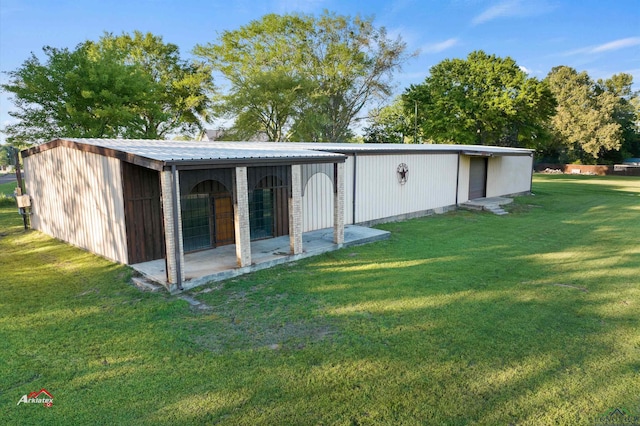 view of outbuilding featuring a lawn