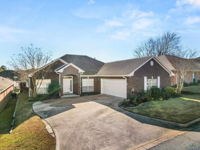 ranch-style house featuring a front yard and a garage