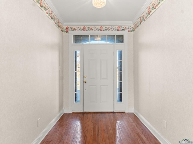 foyer entrance featuring crown molding and wood-type flooring