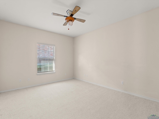 empty room featuring light carpet and ceiling fan