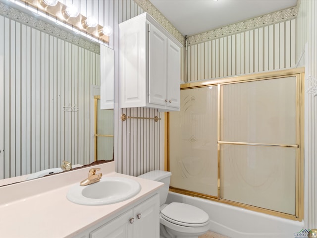 full bathroom with toilet, vanity, and combined bath / shower with glass door