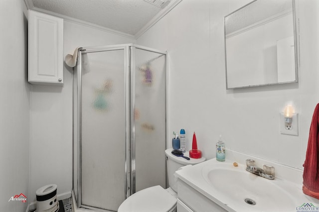 bathroom with vanity, a shower with shower door, ornamental molding, and a textured ceiling