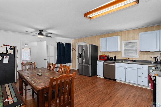 kitchen featuring ceiling fan, sink, a textured ceiling, white cabinets, and appliances with stainless steel finishes