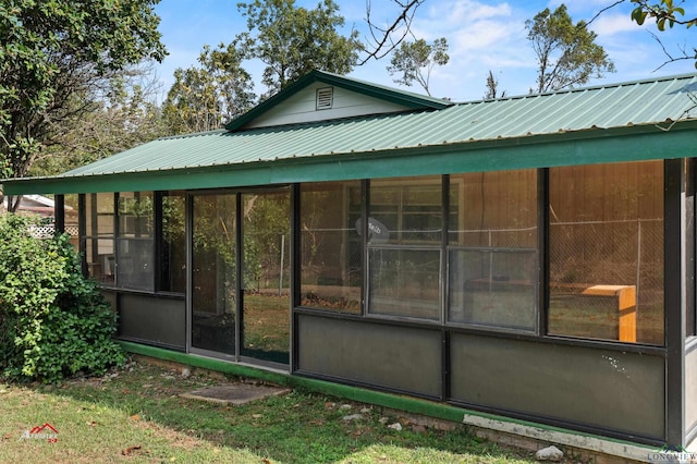 view of home's exterior featuring a sunroom