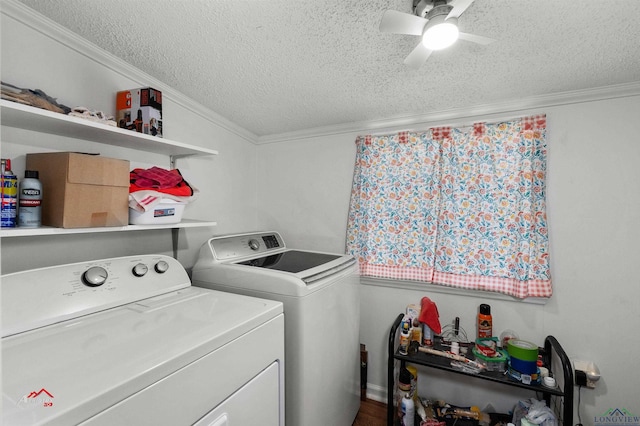 laundry area with a textured ceiling, washing machine and dryer, ceiling fan, and ornamental molding