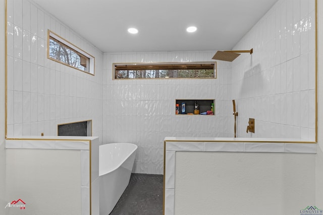 bathroom with plus walk in shower and tile walls