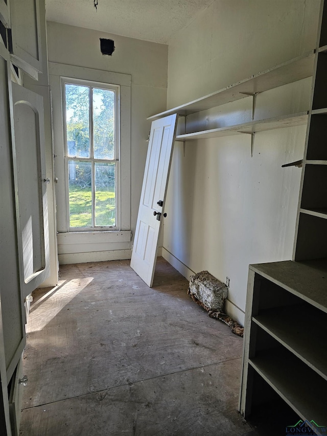 unfurnished bedroom featuring multiple windows