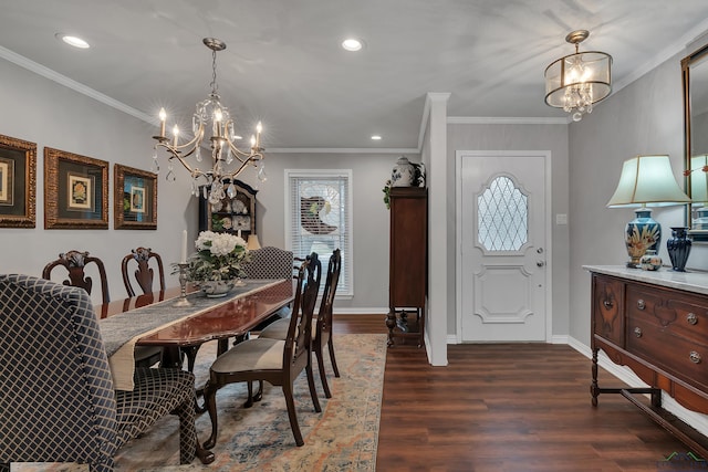 dining space featuring dark hardwood / wood-style flooring, a notable chandelier, and crown molding