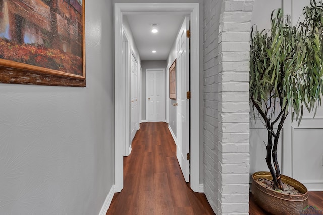 hall with dark hardwood / wood-style flooring