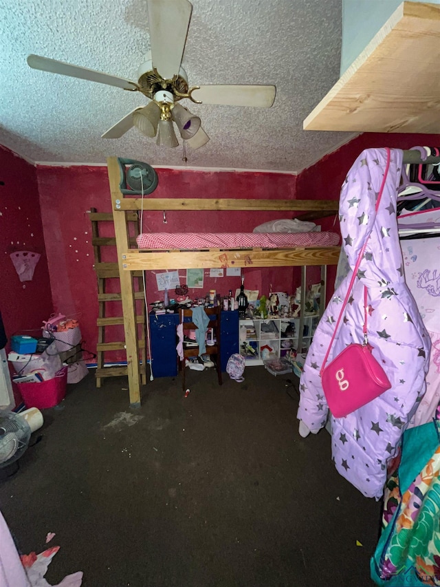 bedroom with ceiling fan and a textured ceiling