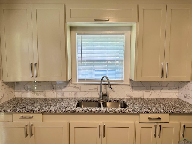 1407 E US-80, White Oak, TX 75693 - kitchen featuring a sink, decorative backsplash, and dark stone counters