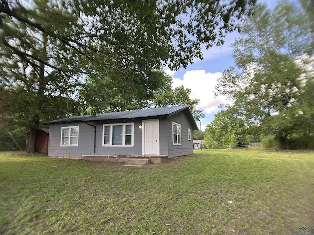 1407 E US-80, White Oak, TX 75693 - view of front facade with a front lawn and metal roof