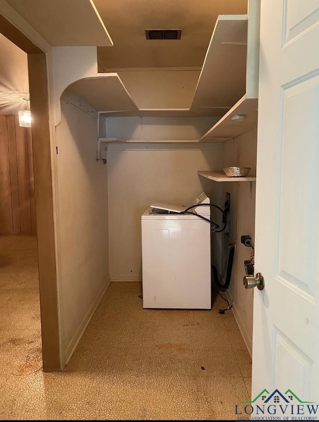 laundry area with laundry area, washer / clothes dryer, baseboards, and visible vents