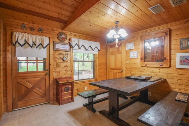 325 Laurel Ln, Holly Lake Ranch, TX 75765 - dining area with light tile patterned floors, wood ceiling, wooden walls, and a chandelier