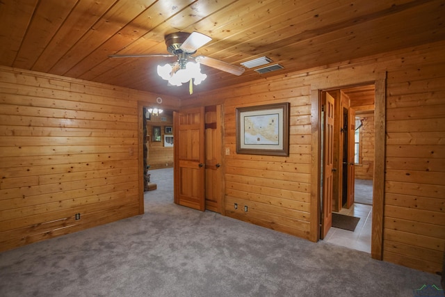 325 Laurel Ln, Holly Lake Ranch, TX 75765 - carpeted spare room with wood ceiling, wood walls, and ceiling fan