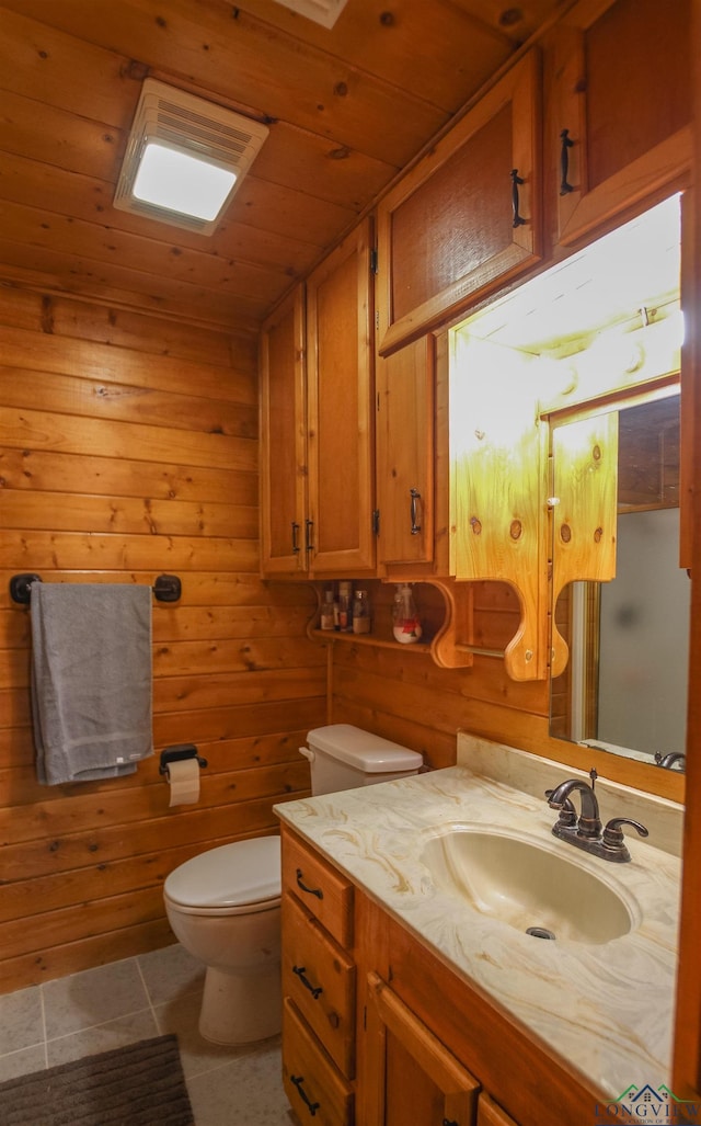 325 Laurel Ln, Holly Lake Ranch, TX 75765 - bathroom featuring toilet, tile patterned floors, vanity, wood ceiling, and wood walls