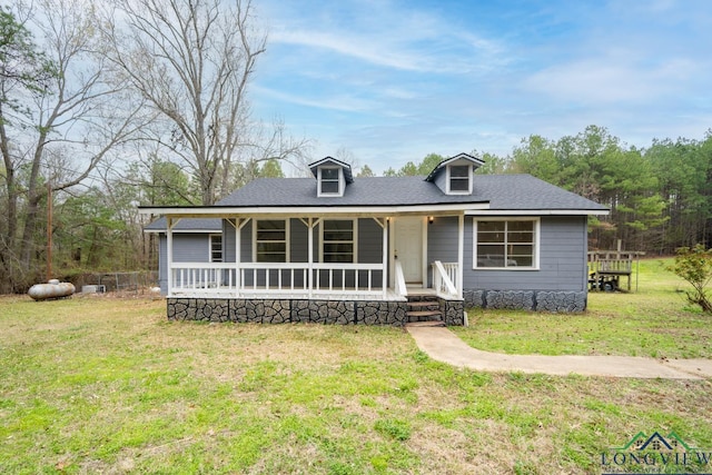 view of front of house with a porch and a front lawn