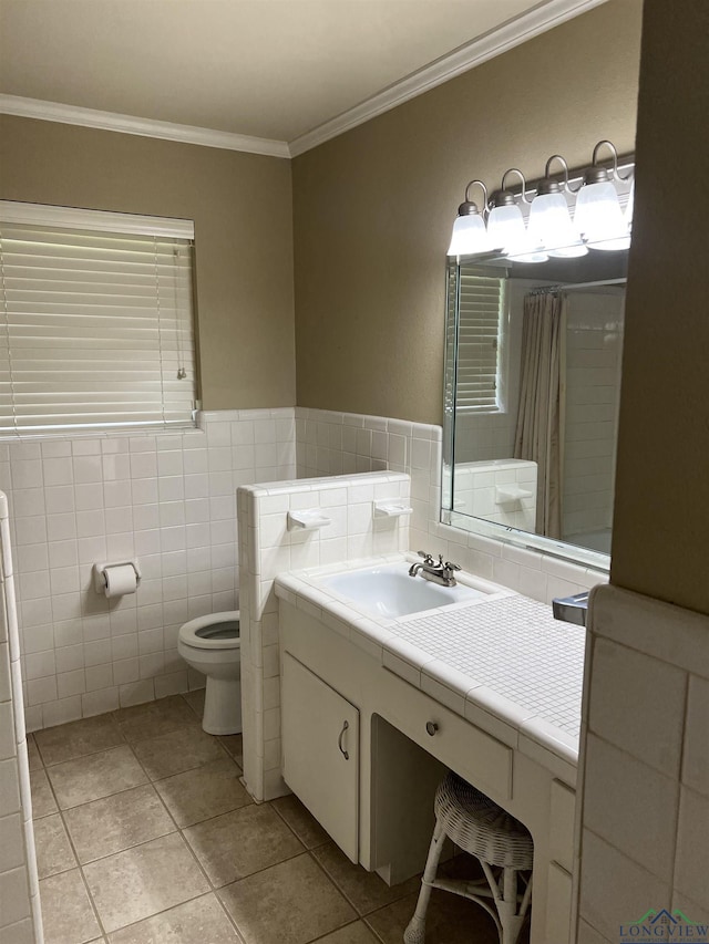 full bathroom featuring crown molding, tile walls, vanity, and toilet
