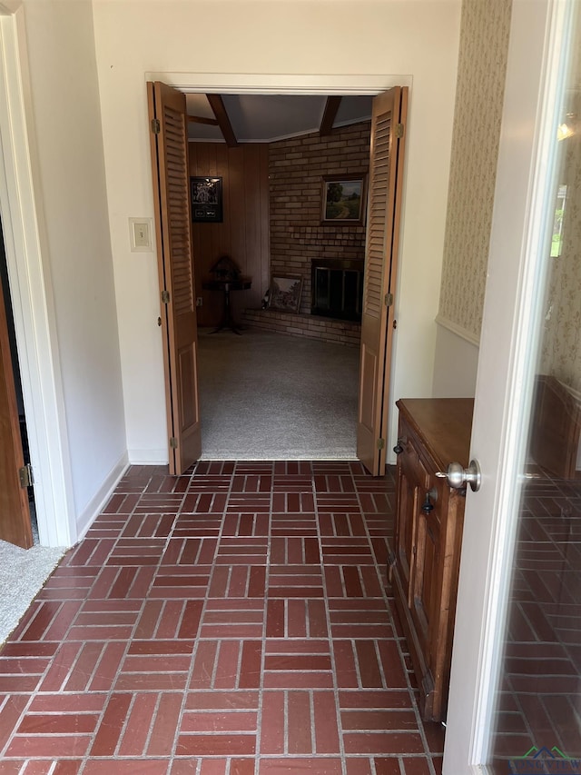 hallway with brick floor