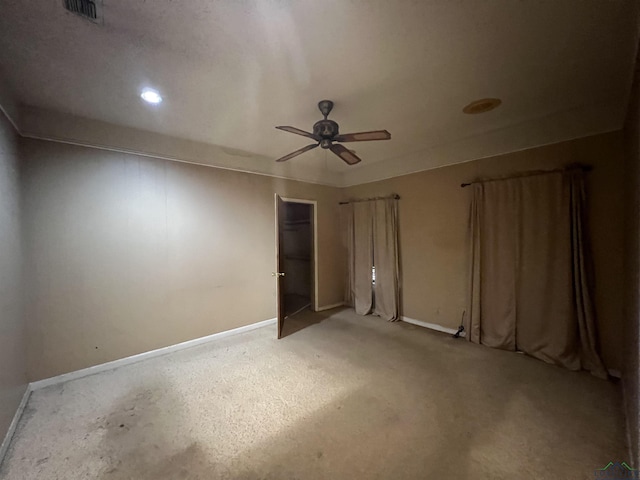 unfurnished bedroom featuring ceiling fan