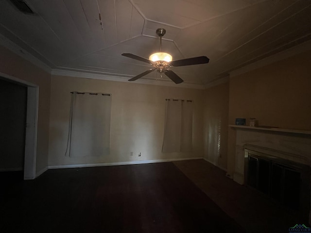 unfurnished living room with a fireplace, ceiling fan, hardwood / wood-style floors, and ornamental molding