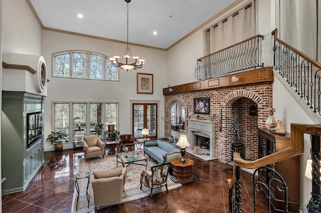 living room featuring a chandelier, a high ceiling, crown molding, and dark tile patterned flooring