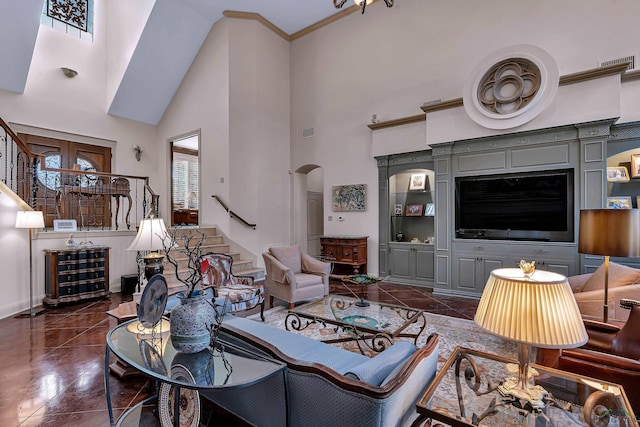 living room featuring dark tile patterned flooring and a towering ceiling