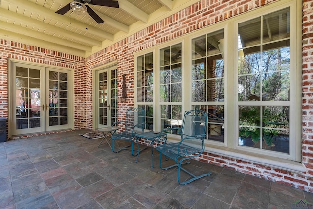 view of patio / terrace featuring ceiling fan and french doors