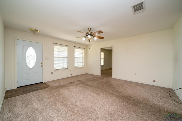 620 County Road 3332, Omaha, TX 75571 - carpeted entrance foyer featuring baseboards, a ceiling fan, and visible vents