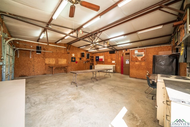 620 County Road 3332, Omaha, TX 75571 - garage with a workshop area and a ceiling fan