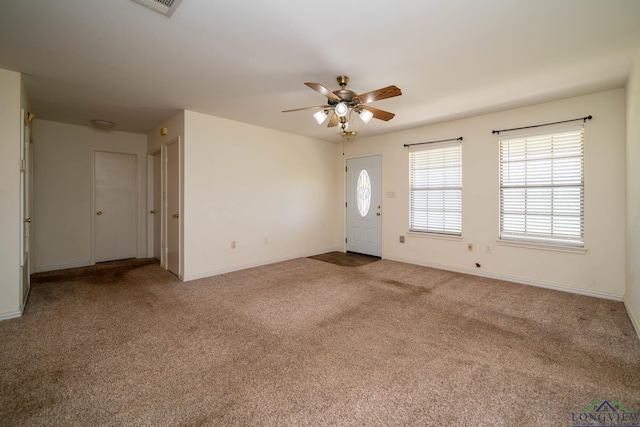 620 County Road 3332, Omaha, TX 75571 - carpeted entrance foyer featuring baseboards and a ceiling fan