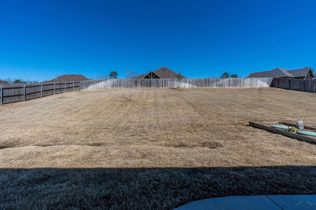 view of yard featuring a fenced backyard