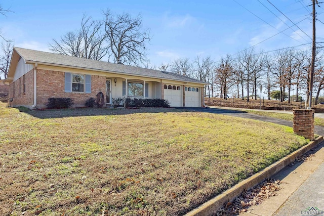 ranch-style house with a garage and a front lawn