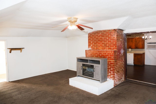 unfurnished living room featuring a wall unit AC, ceiling fan, a fireplace, and dark carpet