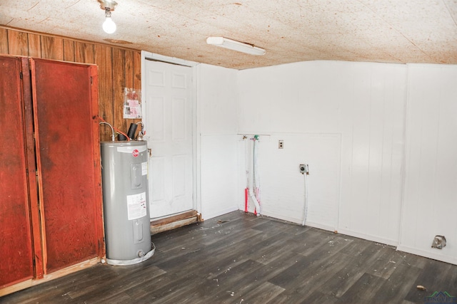 laundry area with hookup for an electric dryer, dark wood-type flooring, and water heater