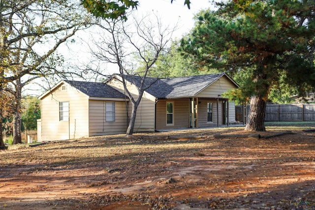 single story home featuring covered porch