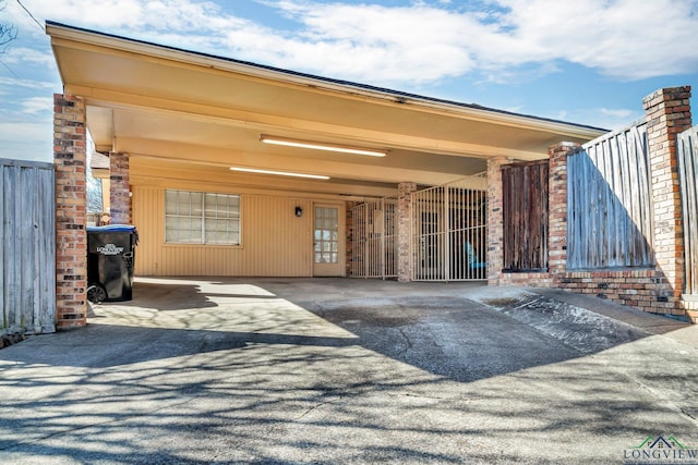 exterior space featuring driveway and an attached carport