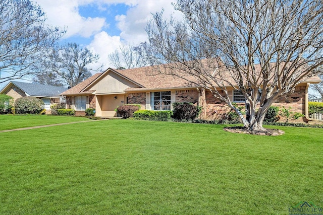 ranch-style home featuring a front yard and brick siding