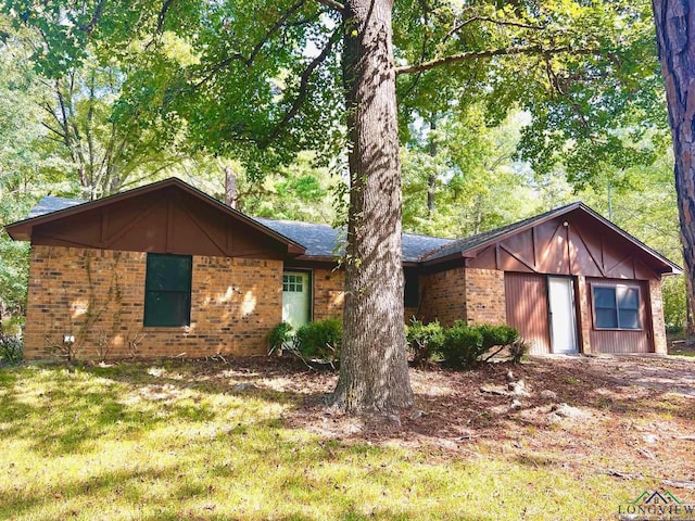 view of front of home featuring brick siding