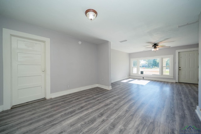 unfurnished living room with hardwood / wood-style flooring and ceiling fan