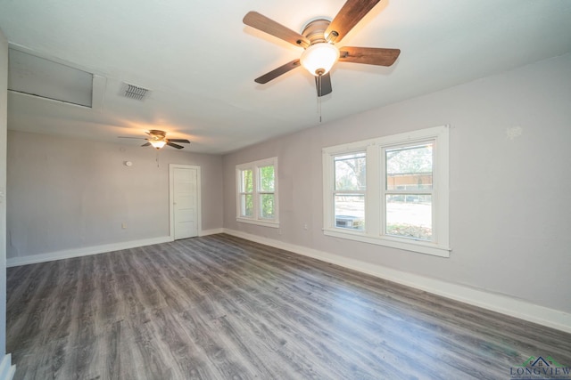 unfurnished room featuring dark hardwood / wood-style flooring