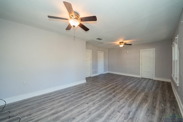 empty room featuring ceiling fan and dark wood-type flooring