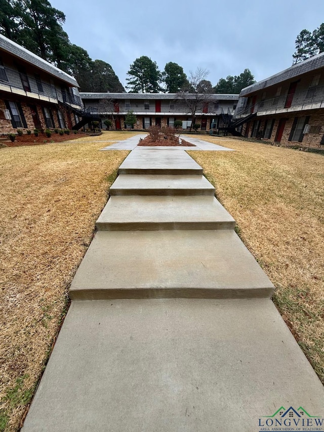 view of home's community featuring a lawn