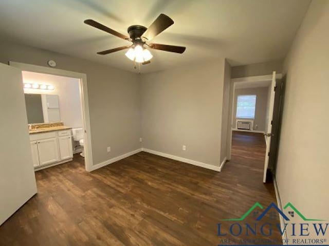 unfurnished bedroom with ceiling fan, ensuite bathroom, and dark hardwood / wood-style floors